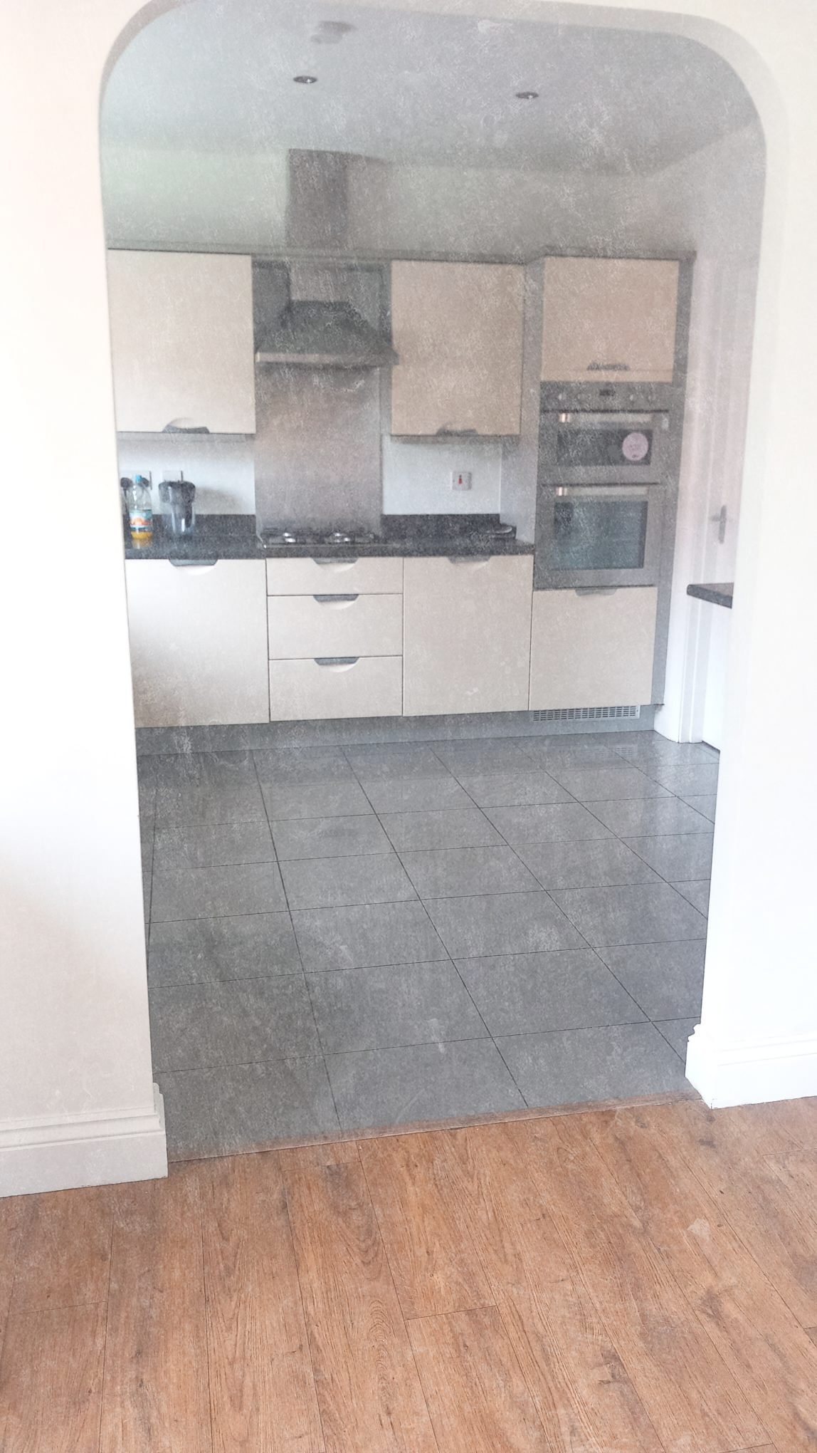 Kitchen viewed through archway